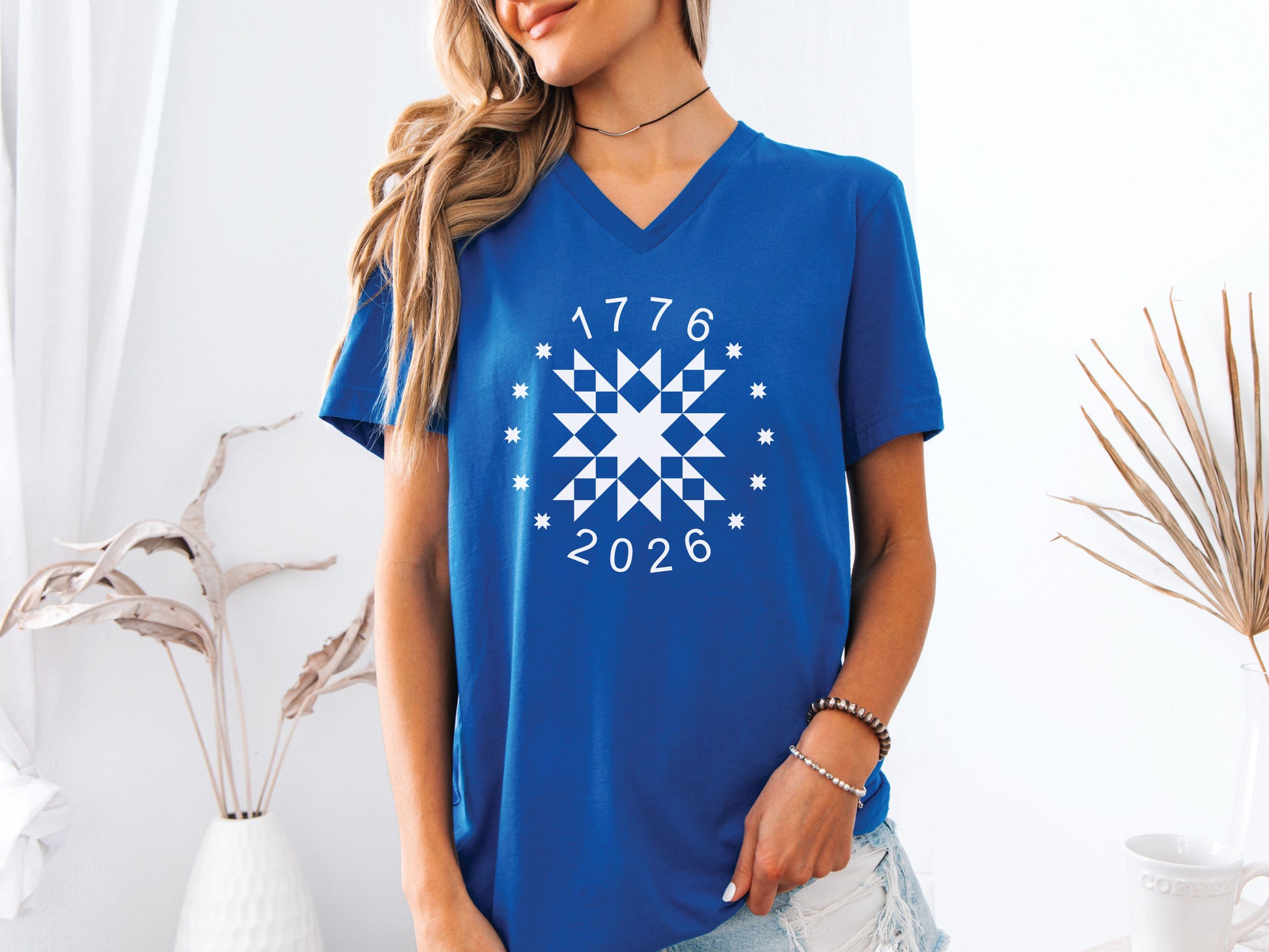 Patriotic quilting t-shirt in navy featuring a white star quilt block with surrounding stars and the years 1776–2026, celebrating America’s 250th Anniversary.