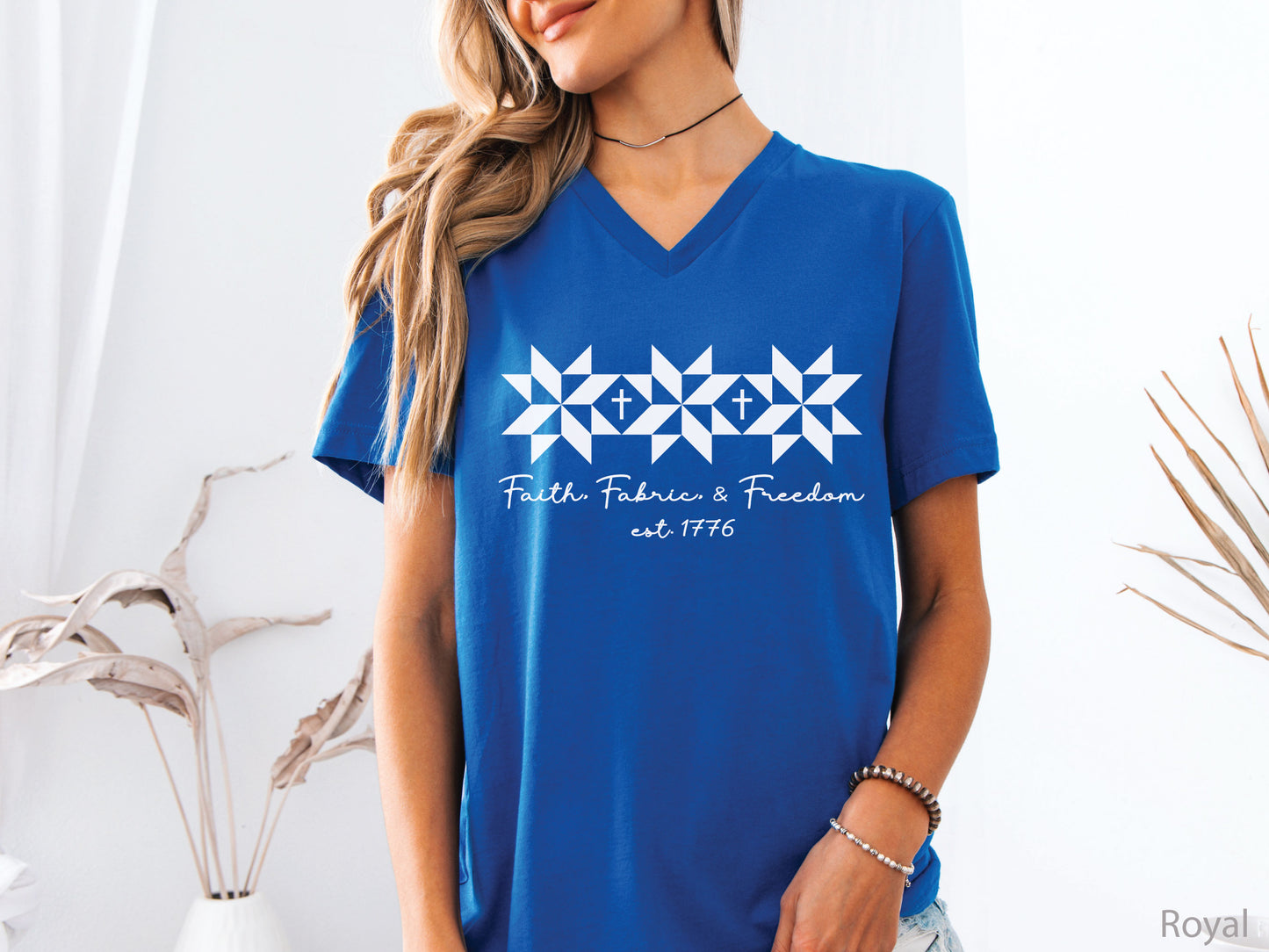 Faith, Fabric & Freedom patriotic v-neck t-shirt with quilt block stars and cross details. Perfect for quilters, sewists, and faith-based gifts.