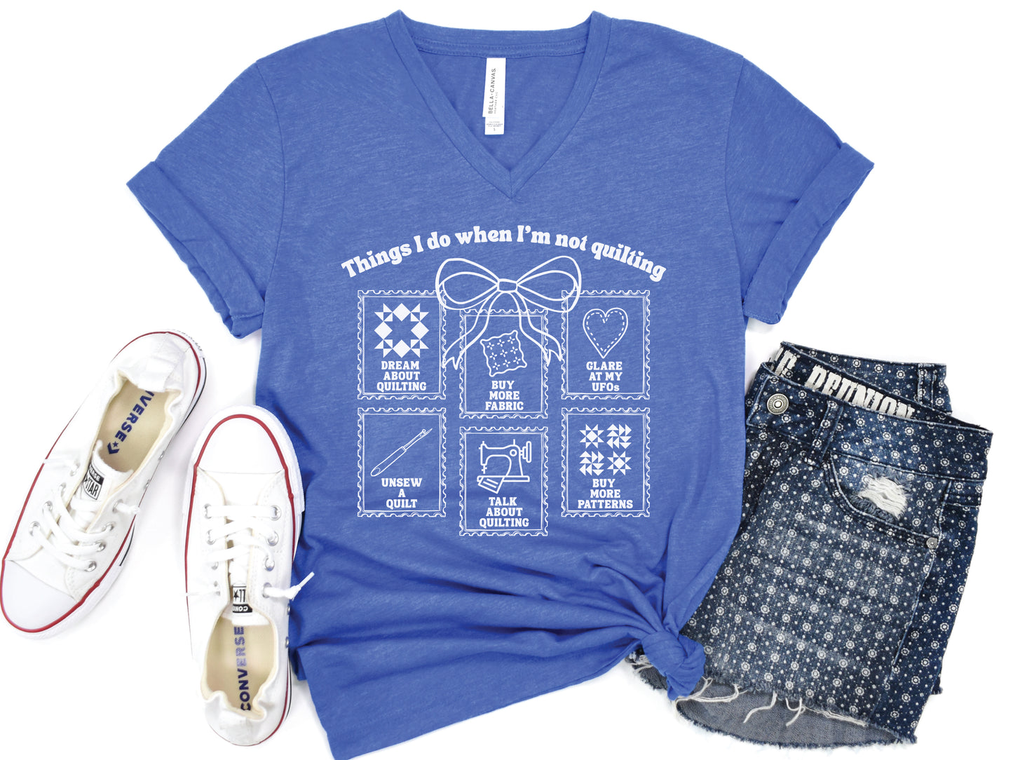 Quilting V-neck t-shirt with “Things I Do When I’m Not Quilting” phrase and stitched-style icons, perfect gift for quilters and sewing enthusiasts.