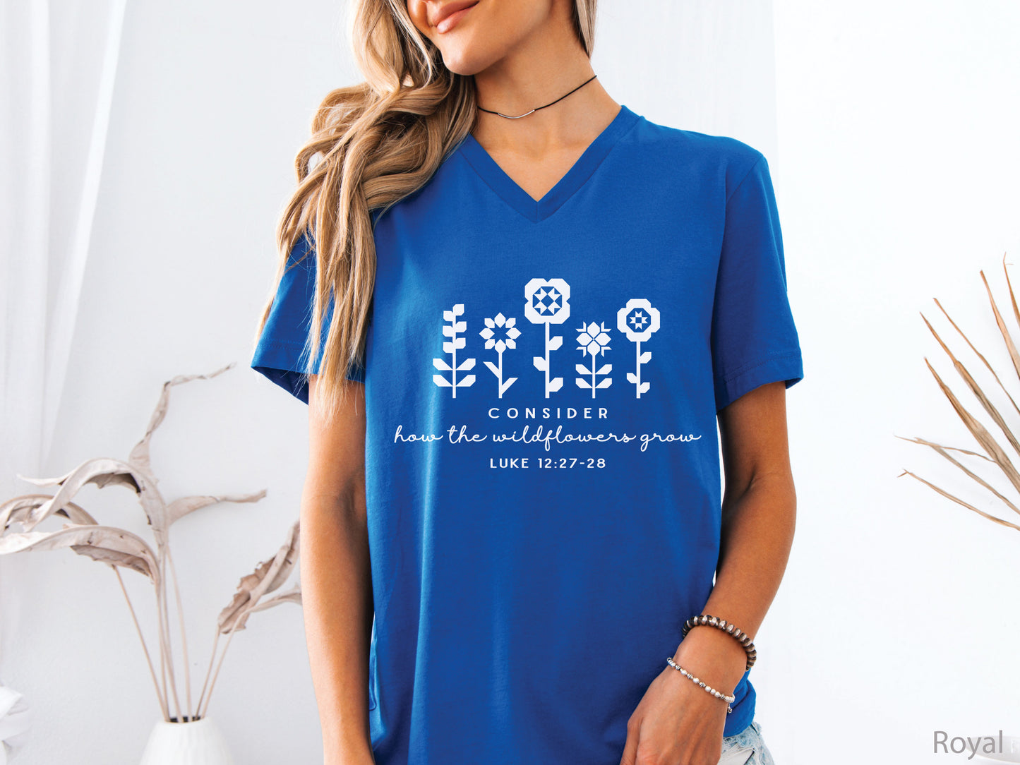 Quilt-inspired wildflower design t-shirt featuring Bible verse Luke 12:27–28, perfect for quilters and faith-based apparel.