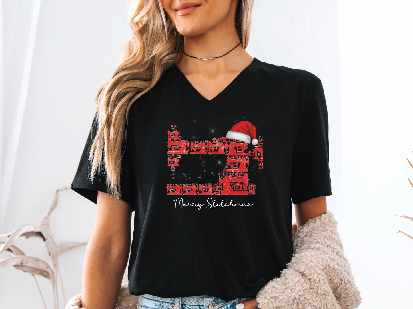 Sewing-themed Christmas design featuring a sewing-machine tree with a Santa hat and “Merry Stitchmas” text on a V-neck t-shirt — fun holiday gift for quilters and sewists.