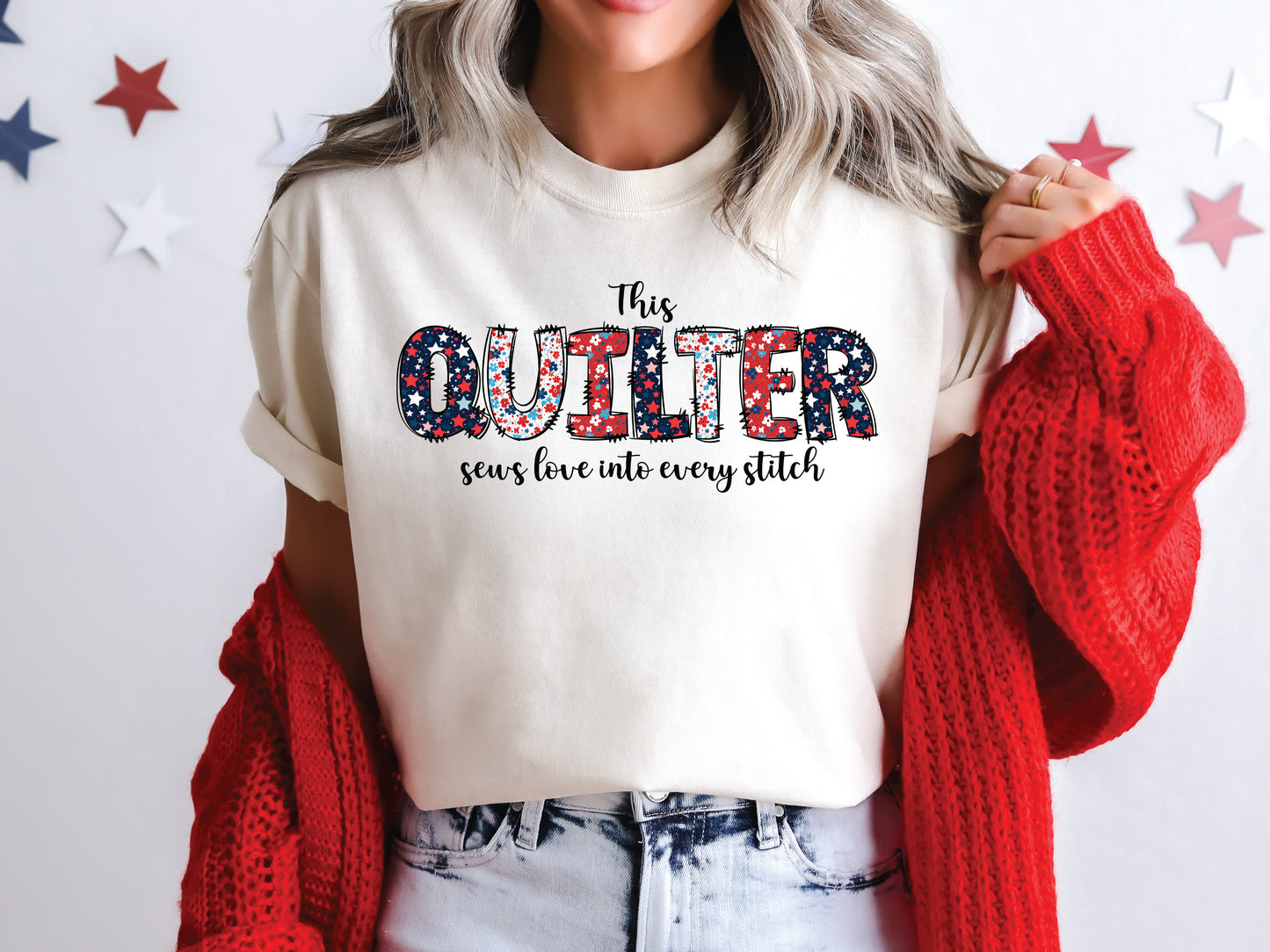 Patriotic quilting t-shirt with the phrase “This Quilter Sews Love Into Every Stitch” in red, white, and blue patchwork lettering, perfect for celebrating America’s 250th Anniversary.