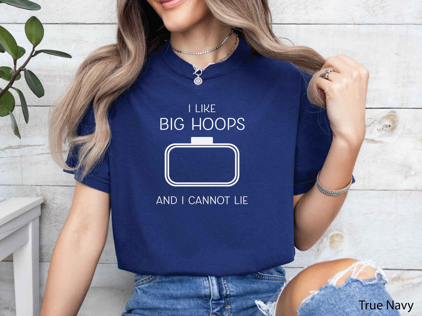 Embroidery-themed t-shirt with the phrase “I Love Big Hoops And Cannot Lie” and an embroidery hoop centered in the design for machine embroidery lovers.