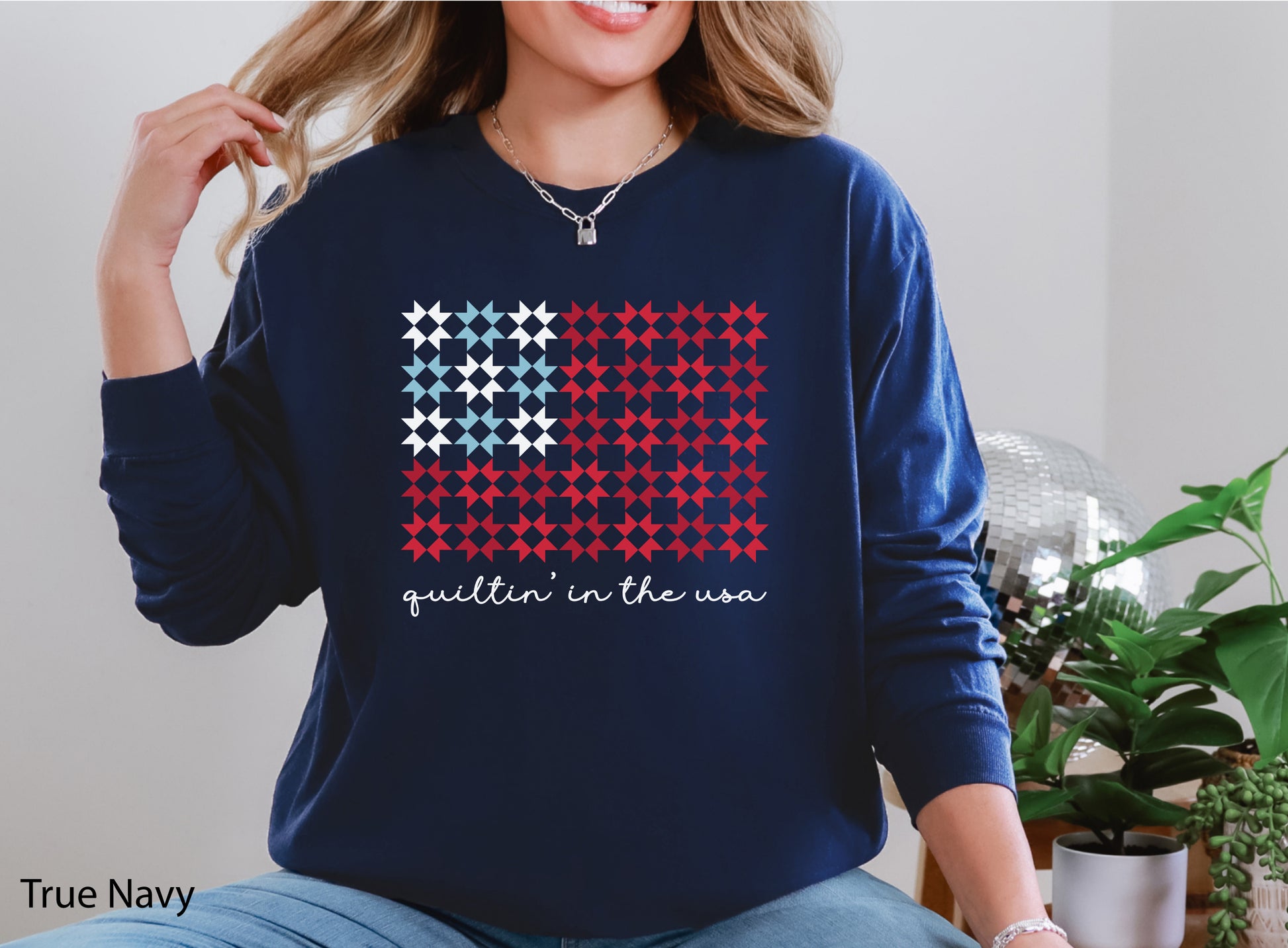 Quiltin’ In The USA quilt long sleeve t-shirt with red, white, and blue quilt block design, ideal for America’s 250th Anniversary and patriotic quilters.