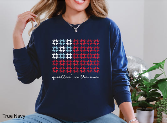Quiltin’ In The USA quilt long sleeve t-shirt with red, white, and blue quilt block design, ideal for America’s 250th Anniversary and patriotic quilters.