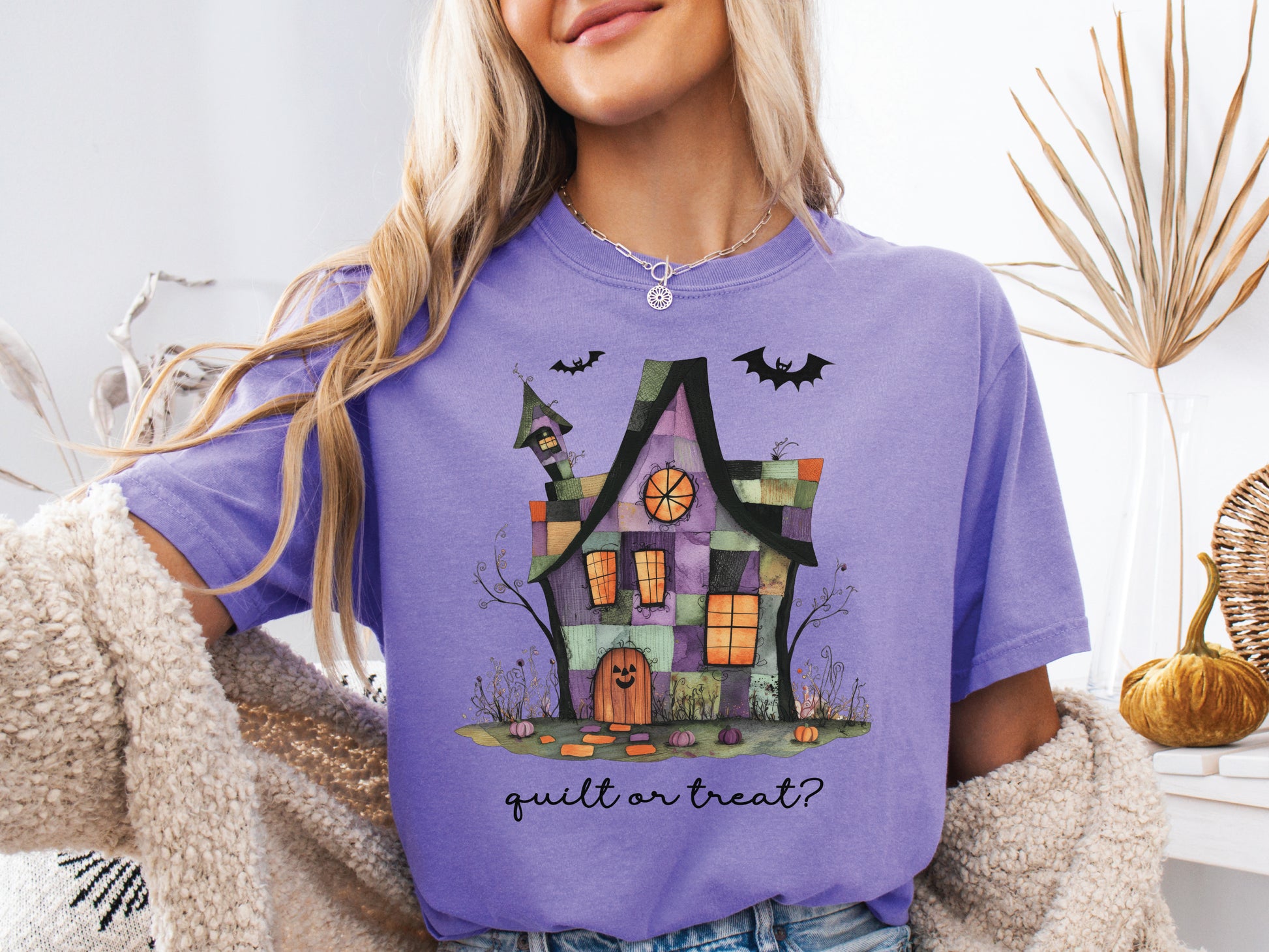 Quilt or Treat Halloween t-shirt on a Comfort Colors Violet tee—fun Halloween gift for quilters, perfect for spooky season sewing and retreats.