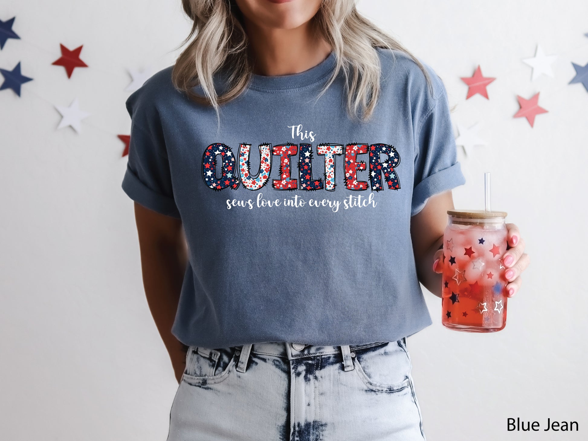Patriotic quilting t-shirt with the phrase “This Quilter Sews Love Into Every Stitch” in red, white, and blue patchwork lettering, perfect for celebrating America’s 250th Anniversary.