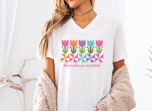 Bloom wherever you go with this quilt tulip v-neck tee featuring colorful patchwork blocks and “Bloom Where You Are Stitched”—perfect for quilters and sewists.