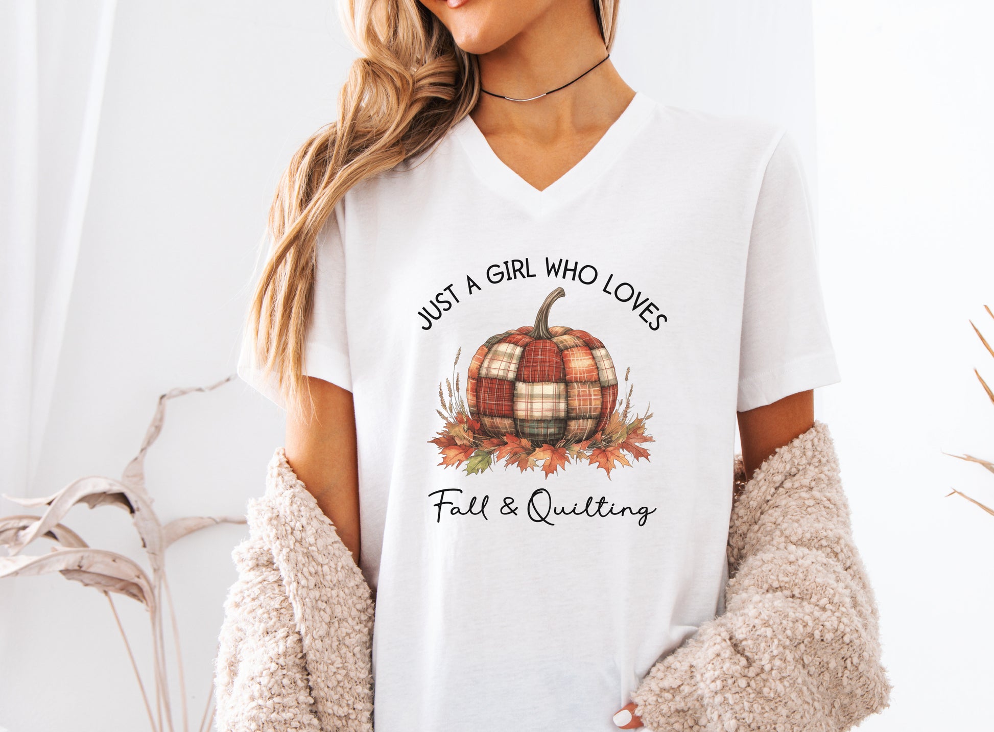 Just a Girl Who Loves Fall & Quilting t-shirt featuring a plaid pumpkin surrounded by colorful autumn leaves, designed for quilters who love cozy fall sewing, quilt retreats, and pumpkin spice season.