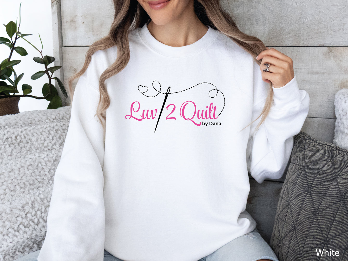 Official Luv2Quilt by Dana quilting-themed sweatshirt featuring the Luv2Quilt logo with a sewing needle and stitched heart design, perfect for quilt classes, retreats, and everyday wear.
