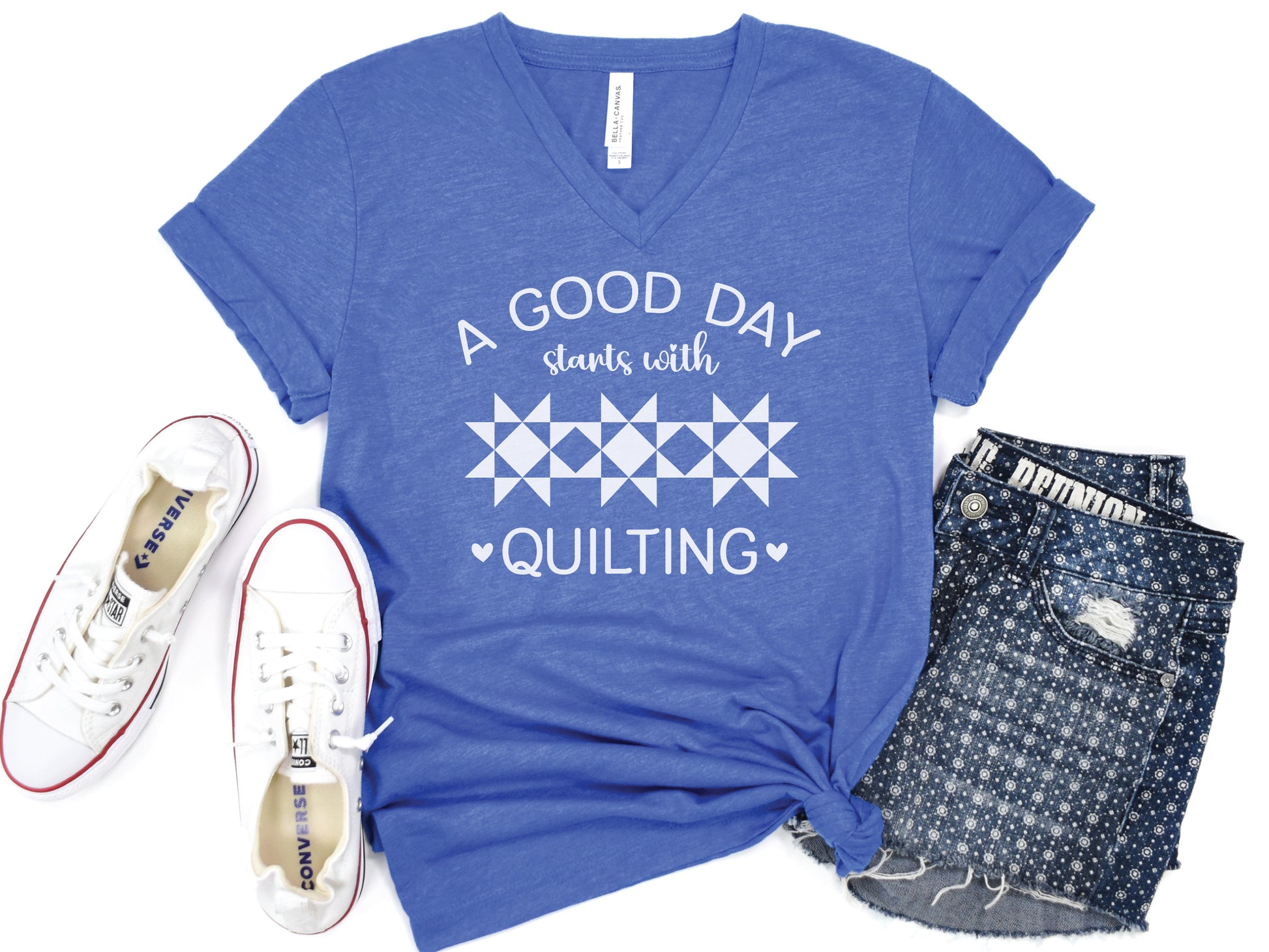 A Good Day Starts With Quilting” T-shirt on a soft heather royal V-neck — a fun gift for sewing and quilting lovers, celebrating every stitch, even with a seam ripper.