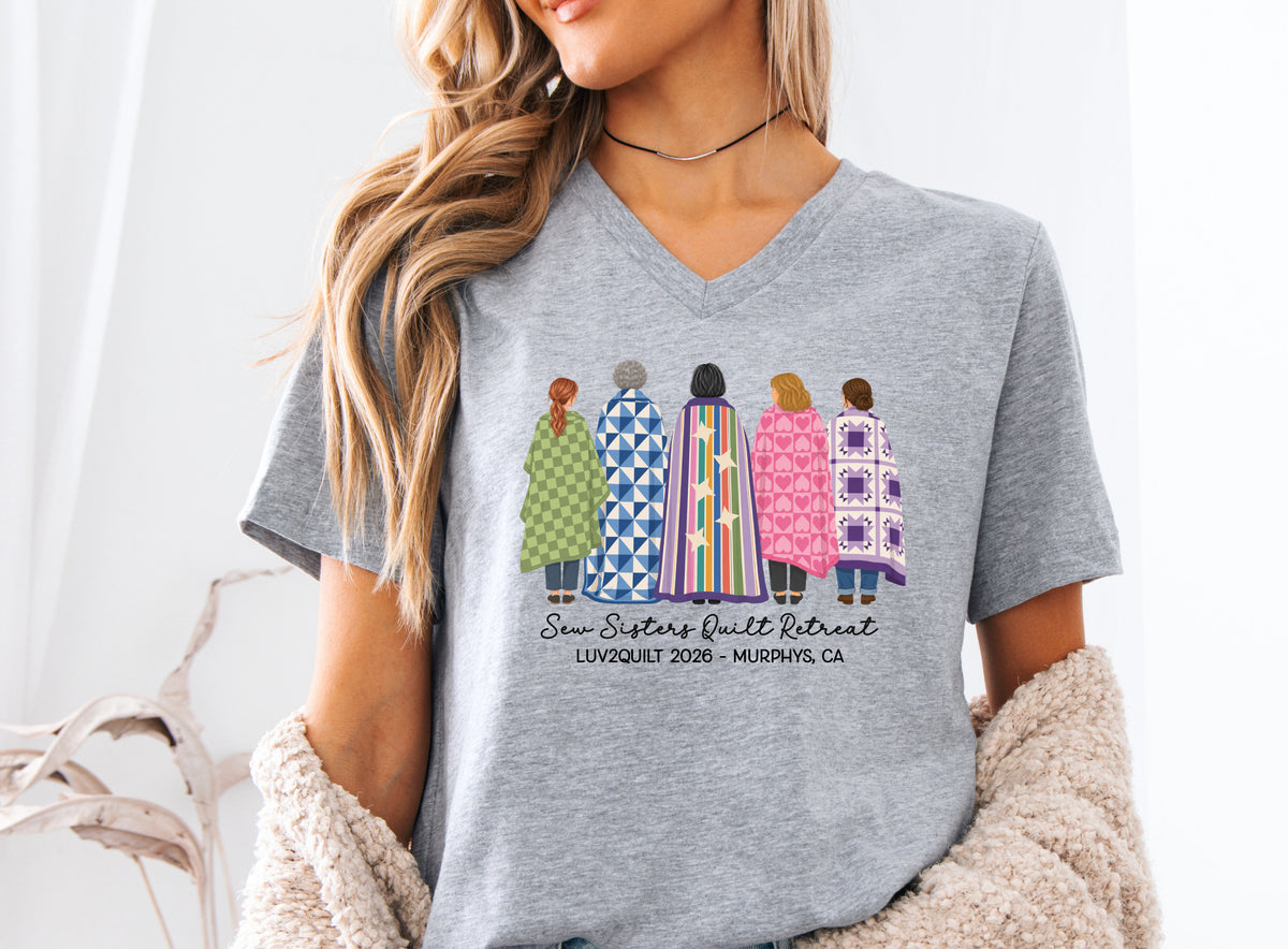 Sew Sisters Quilt Retreat shirt design featuring five women wrapped in colorful green, blue, striped, pink heart, and purple quilts with LUV2QUILT personalized text.